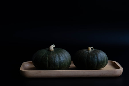 2 pumpkins on black backgroundの写真素材