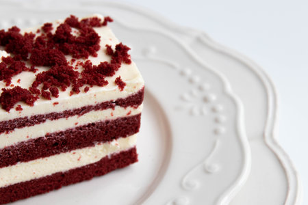 Red velvet cake on a white plate. Shallow dof.