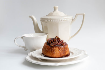 Sticky Bun with  pecans on white background,の写真素材