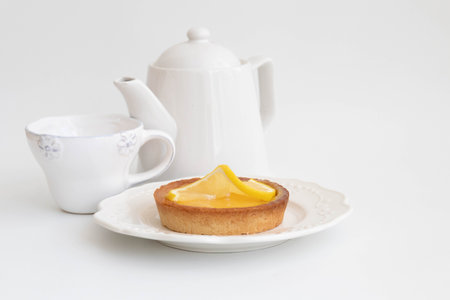 Lemon tart on White Ceramic plate, White backgroundの写真素材