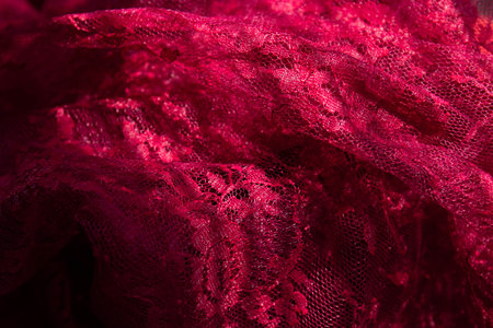 Texture, background, pattern. Lacy red fabric.の写真素材