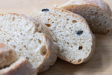 Italian Bread, Olive Ciabatta, Wrapped with Grey Napkin on Grey Background