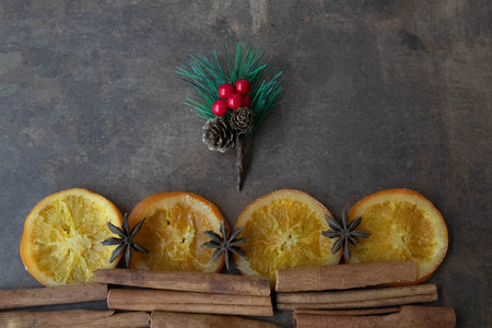 Slice Candied Oranges , Cinnamon sticks and Star Anise on Rustic Background