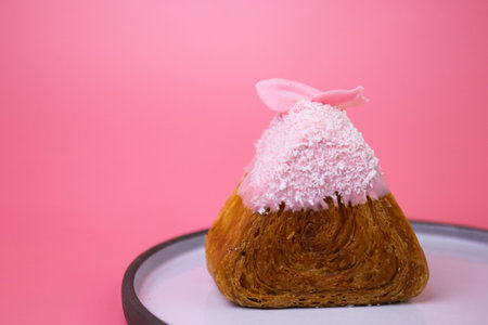 Onigiri croissant topped with whipped cream