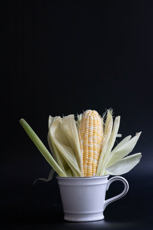 Close up Texture and Pattern of Fresh Corn on dark backgroundの写真素材