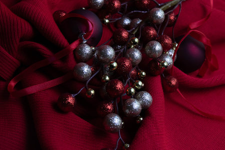 Christmas decoration on red fabric background. Close up. Selective focus.の写真素材