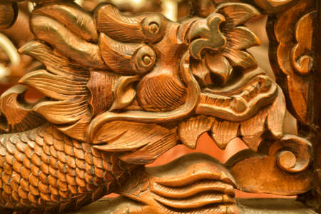 brown wood  dragon carvingの写真素材
