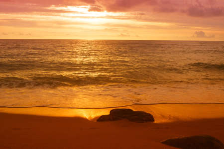 Colorful sunset at the beach backgroundの写真素材