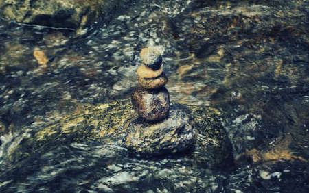 Zen stone in water , meditation and peaceful signの写真素材