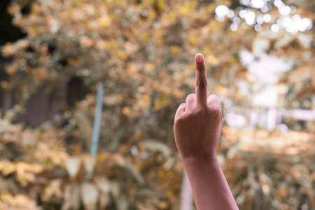 Hand showing middle fingerの写真素材