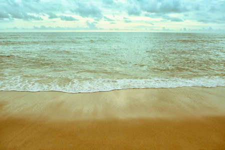 sea wave  and  brown sand  the beach summer backgroundの写真素材