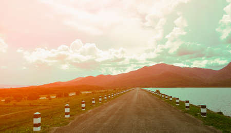 The road and mountain  with damp  landscape backgroundの写真素材