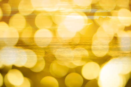 golden sea  in with bokeh ligh abstract summer  backgroundの写真素材