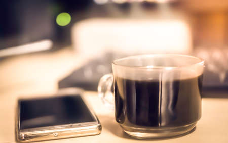 blur of coffee and mobile   business backgroundの写真素材
