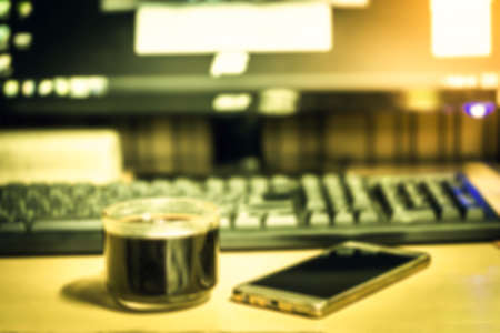 blur of coffee ,mobile and computer business backgroundの写真素材