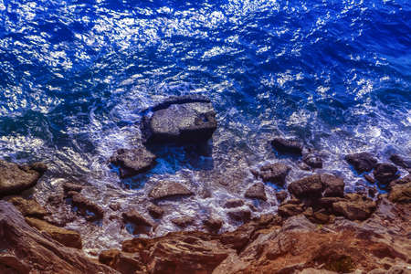 blue sea  and brown stone beach  landscape background 