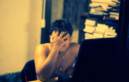 Sad  Asian  man  sitting  and thinking   at  something soft  and selective focus