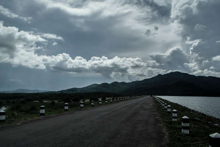 The road in damp  with blue sky nice view の写真素材