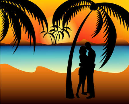Silhouettes of two lovers on a beachの写真素材