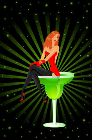 The beautiful harmonous sexy girl sits in a glass with a cocktailの写真素材