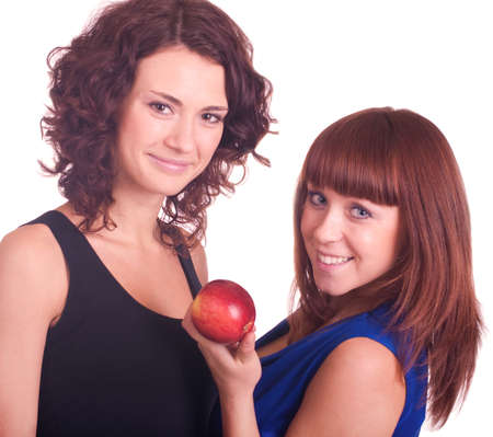 Beautiful smiling girls with apple on white backgroundの写真素材