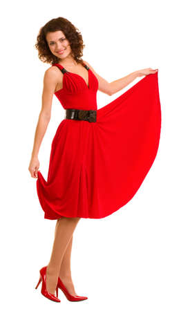 Sexy young woman in red dress isolated on white background.の写真素材