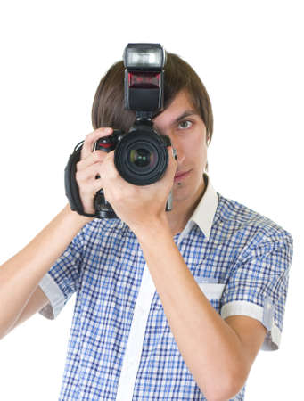 young man photographer doing photos by digital cameraの写真素材