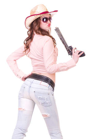 Pretty girl with cowboy hat with revolver on white backgroundの写真素材