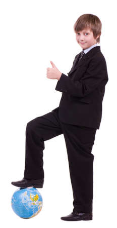 Little successful schoolboy with globe isolatedの写真素材