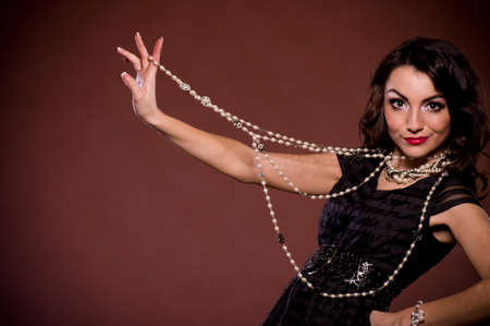 Beautiful young woman on dark backgroundの写真素材