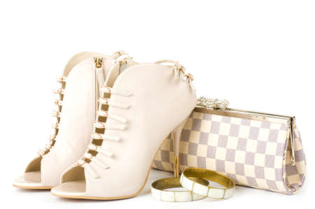 Sexy fashionable shoes, golden jewelry and handbag isolated on white background の写真素材