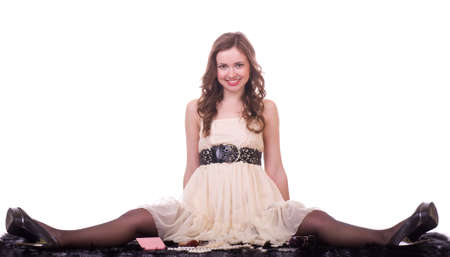 Young beautiful girl with various cosmetics on black furの写真素材