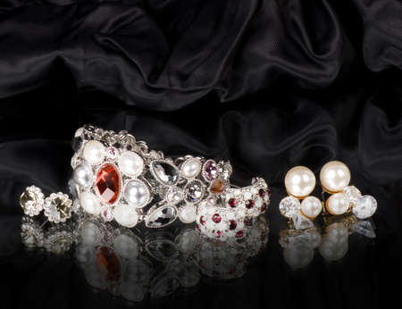 Silver jewelry on black backgroundの写真素材