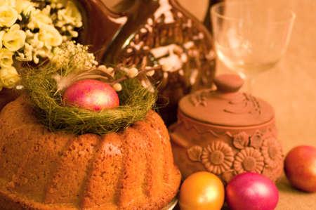Traditional Easter cake and easter eggs with flowersの写真素材