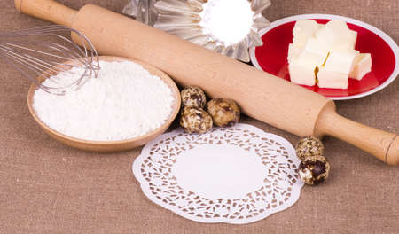 Tasty ingredients for baking on background