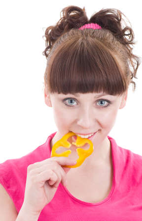Beautiful young girl with pepper on white background の写真素材