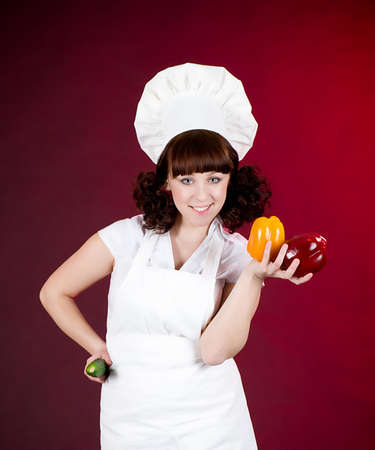 Smiling happy cook woman with vegetablesの写真素材