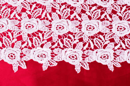 Vintage lace with flowers on red backgroundの写真素材