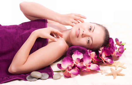 Beauty spa woman with flower on backgroundの写真素材