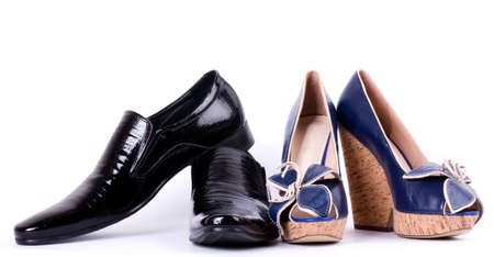 Sexy fashionable man s and womanish shoes on white background の写真素材