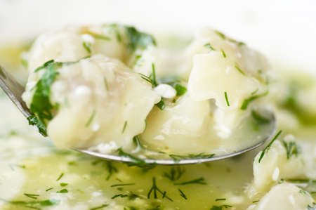 Meat dumplings - ravioli with dill and parsleyの写真素材