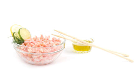 Tasty boiled shrimps on plate and chopsticks on white backgroundの写真素材