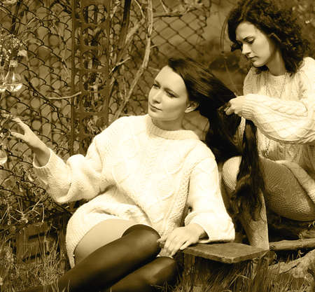 Beautiful girls in spring gardenの写真素材