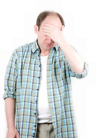 Portrait of old man having a headache on white backgroundの写真素材
