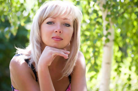 Beautiful woman in spring gardenの写真素材