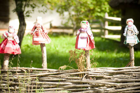 Collectible Ukrainian folk dolls in gardenの写真素材