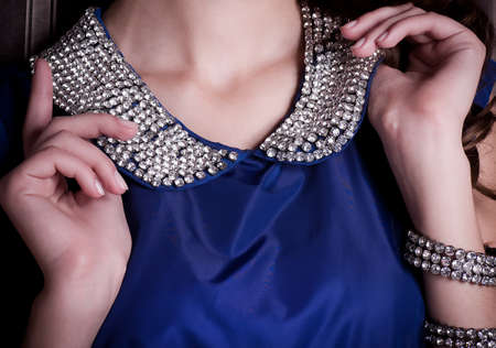 Luxury female collar with gems on blue dressの写真素材