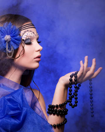 Portrait of beautiful young woman with makeup
