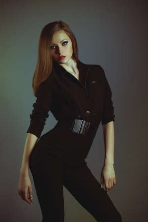 Beautiful young woman in fashion clothes