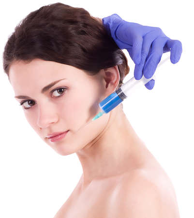 Beautiful woman gets an injection in her face